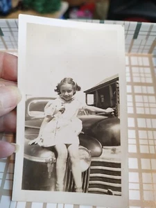 Vintage Photo Of A Young Girl Sitting On The Hood Of A Vintage Car - Picture 1 of 3