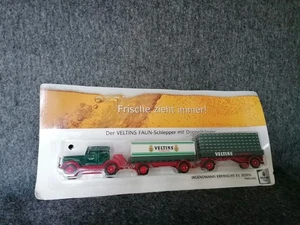 Mini camión publicitario Veltins, Faun L8 Nostalgie HZ 2 colgantes cajas de cerveza 1:87 en embalaje original - Imagen 1 de 9