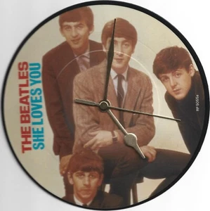 THE BEATLES - SHE LOVES YOU 7" VINYL RECORD WALL CLOCK - Picture 1 of 1