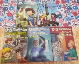 A TO Z MYSTERIES - RON ROY - LOT OF 5 PAPERBACK BOOKS - SEE PHOTOS FOR TITLES - Picture 1 of 2