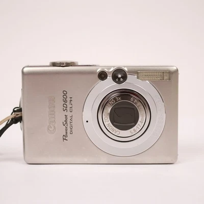 Cámara digital Canon PowerShot ELPH SD600 plateada cargador SD de 2 GB probado con batería Foto 1 de 4