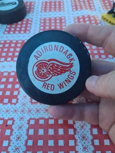 Vintage Adirondack Red Wings AHL Hockey Puck MS000487 - Picture 1 of 2