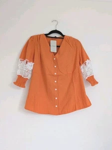 Crochet Panel Button Up Orange V Neck Blouse With Puff Smocked Sleeves UKL NWT - Picture 1 of 9