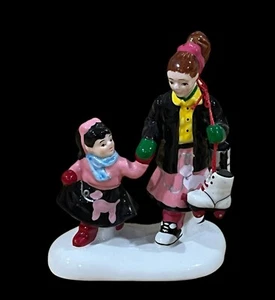 Department 56 Snow Village Everybody Goes Skating Figurine 3" x 2.5" - Picture 1 of 5