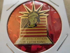 DH AID VEREINIGUNG FÜR LUTHERANER PIN BLÜHENDE STATUE FREIHEITSFLAGGE RELIGIÖSE ANWERBUNG - Bild 1 von 4
