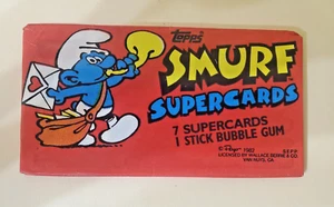 Paquete de cera Topps Smurf Supercards 1982/nuevo sin abrir/7 tarjetas y goma de mascar - Imagen 1 de 2