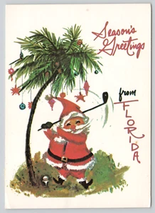 Tarjeta postal saludos de temporada de Florida Golfing Santa - Imagen 1 de 2