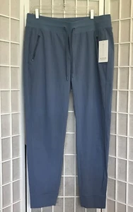 Jogger Athleta Trekkie North 16 de altura Ripstop absorbente bolsillos con cremallera atletismo - Imagen 1 de 14