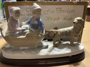 Estatuilla de porcelana de perro vintage 1996 The Paul Sebastian Collection paseo en trineo - Imagen 1 de 5