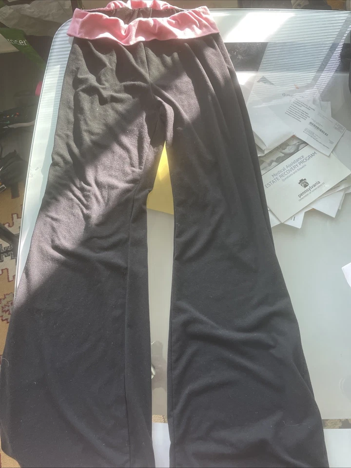 Pantalones negros elásticos acampanados plegables talla L Foto 1 de 2