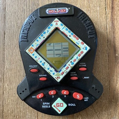 Monopoly Jackpot Juego de Máquina Tragamonedas de Casino Electrónico de Viaje de Mano 1999 Foto 1 de 3