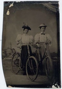 EARLY BICYCLES   TWO LADIES W/ LONG SKIRTS   HATS TINTYPE - Picture 1 of 1