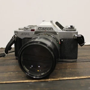 Canon AV-1 35mm SLR Film Camera with FD 135mm 1:2.8 Lens - Picture 1 of 9