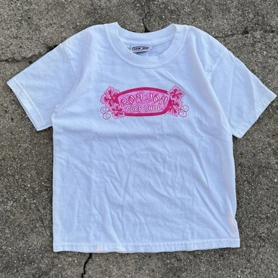 Camiseta Ron Jon Surf Shop Logo Brillo Juvenil Pequeña Blanca Rosa Y2K Bebé Camiseta Ajuste Foto 1 de 4