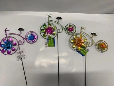 New! Set of 3 Metal Bicycle Yard Stakes Flower Spins Purple Green and Yellow - Image 1 of 4