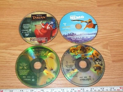 Lot of 4 Disney Movies Tarzan/Finding Nemo/Tinkerbell/Snow Buddies *DISC ONLY* - Image 1 of 2