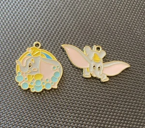 Set Of 2 Disney Dumbo Flying Elephant Enamel Metal Charm Pendant - Picture 1 of 2