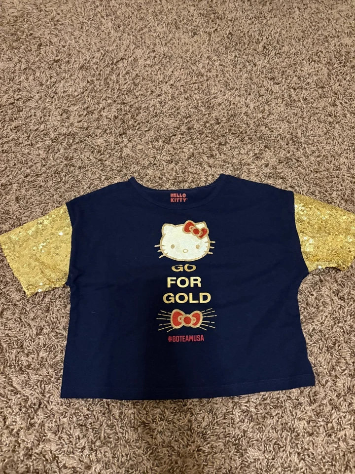 Camisa Hello Kitty X Team EE. UU. Mediana 7/8 Negra Go For the Gold Mangas Brillantes Foto 1 de 3