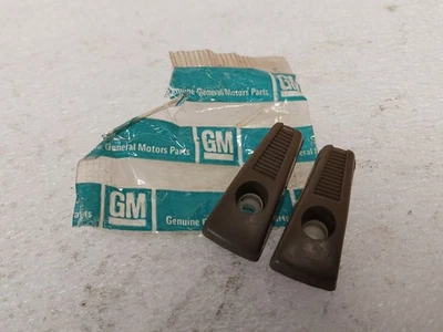 NOS 1967-1974 Chevy Camaro & Pontiac Firebird Tan Louvered Rear Coat Hooks Pair - Image 1 of 4