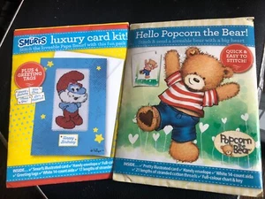 CROSS STITCH CARD KITS X2 SMURFS/POPCORN BEAR COMPLETE WITH CHARTS UNUSED - Picture 1 of 3