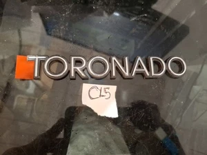 NOS 1980s OLDSMOBILE TORONADO PLASTIC STICK ON EMBLEM - Picture 1 of 4