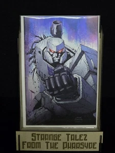 FOIL TRANSFORMERS #22 SDCC SHELBY ROBERTSON MEGATRON VIRGIN VARIANT LTD 666 2025 - Picture 1 of 3