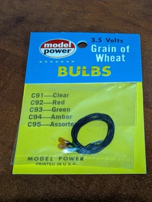 Model Power - HO Scale - #C94 - 3.5V Grain Of Wheat Yellow Light Bulbs (2) - NOS - Image 1 of 3