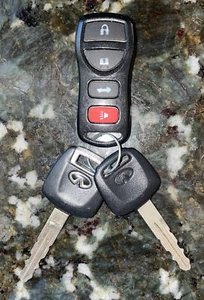 OEM INFINITI G35 Keyless Entry Remote Fob and Keys KBRASTU15 ASTU15 - Picture 1 of 5