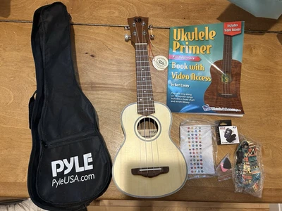 Pyle, Ukelele 4 Cuerdas Modelo PUKT6580 con Bolsa y Accesorios - Nuevo/Caja Abierta Foto 1 de 4