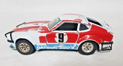 BURAGO 0133 1:24 DATSUN 240 Z Nissan Team - USATA CON DIFETTI - VEDI FOTO - Immagine 1 di 4