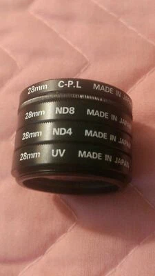 Nikon 28mm ND4 ND8 UV C.P.L. 4 Piece Filter Set - Image 1 of 4