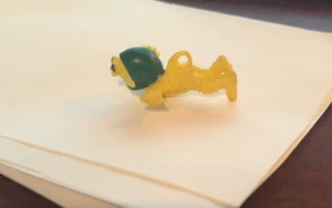 VINTAGE 1970'S IMPERIAL TOYS SOFT RUBBER YELLOW / GREEN POOPATROOPER FIGURE - Picture 1 of 6