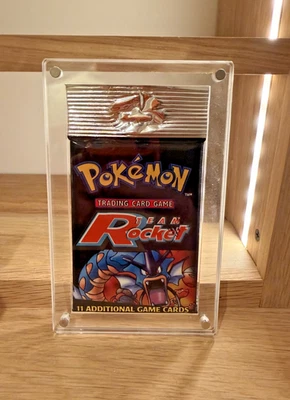 Pokémon WOC06176 TCG Team Rocket Booster Pack - 11 cartas Foto 1 de 2