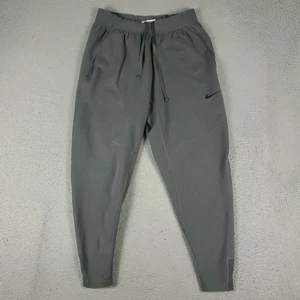 Pantalone Nike uomo grigio medio joggers conici logo swoosh coulisse atletico - Foto 1 di 11