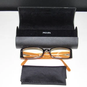 MARCOS DE GAFAS PRADA CON TELA DE MICROFIBRA Y CIERRE MAGNÉTICO CARCASA DURA... - Imagen 1 de 9