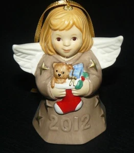 2012 Goebel Bell Christmas Ornament Nutmeg Angel Holding Stocking Full of Toys - Picture 1 of 3