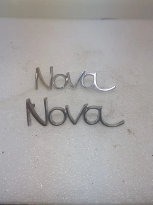 Pair Original 68-72 Chevrolet Nova Fender Emblem Trim Script Plate 3943200  - Image 1 of 4
