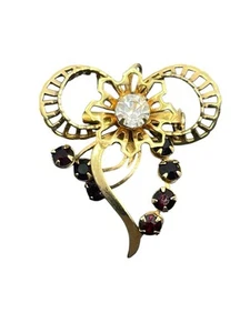 Spilla fiocco tono oro strass rosso anni '50 ciondolo vintage rivetti - Foto 1 di 12