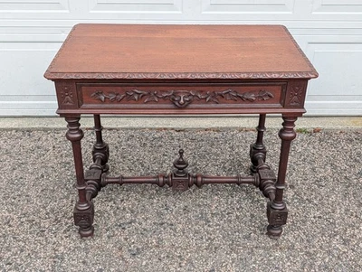 Antiguo escritorio francés del siglo XIX, roble macizo, hojas y rostros tallados Foto 1 de 4