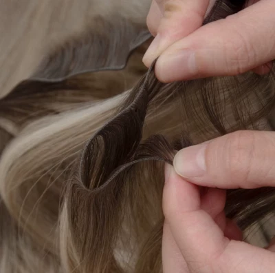 Trama Genius invisible atada a mano delgada 10A Remy rusa 100 % cabello humano Remy 100 g Foto 1 de 4