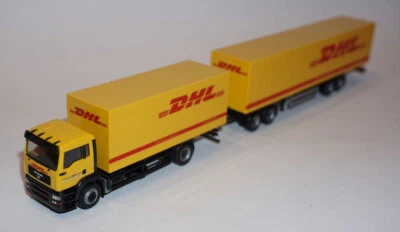 HERPA Train routier MAN TGA M 4x2 baché + semi remorque bâchée DHL HO 1/87 - Photo 1/4