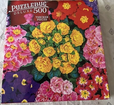 Puzzle bug deluxe 500 piece puzzle colorful garden Primulas - Image 1 of 3