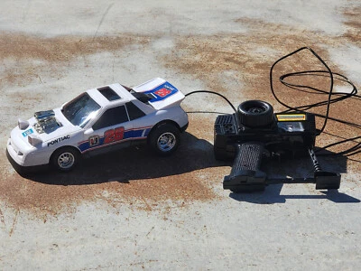New Bright 1990 RC Pontiac mit Kabelfernbedienung Vintage Radio Control - Bild 1 von 4