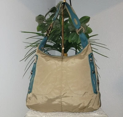 Bolso de hombro unisex TUMI de nailon camel con ribete de cuero verde azulado con cremallera lateral Foto 1 de 4