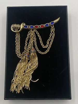 Broche prendedor borla cristal HEIDI DAUS "Saberous Sword" rojo y azul Foto 1 de 4