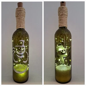 CLEARANCE ....1 X GREEN XMAS LIGHT UP BOTTLE, PAINTED SNOWMAN (3) LAST ONE - Picture 1 of 1