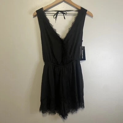 Mameluco Bebe nuevo con etiquetas sin mangas con ribete de encaje talla pequeña negro cintura elástica Foto 1 de 4