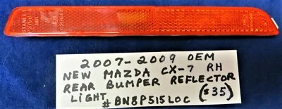 2007-2009 OEM New Mazda CX-7 Right Passenger Side Rear Bumper Reflector Light - Image 1 of 3