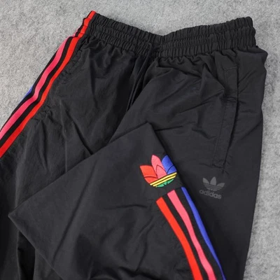 Pantalones Adidas Mujer Pequeños Negro Trifolio Originales 3 Rayas Pista Nylon Arco Iris Foto 1 de 4