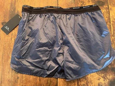 NUEVO Pantalones Cortos para Correr Oakley Luxe Ligeros Gris Metálico Talla XS Ceniza Oscura Foto 1 de 4